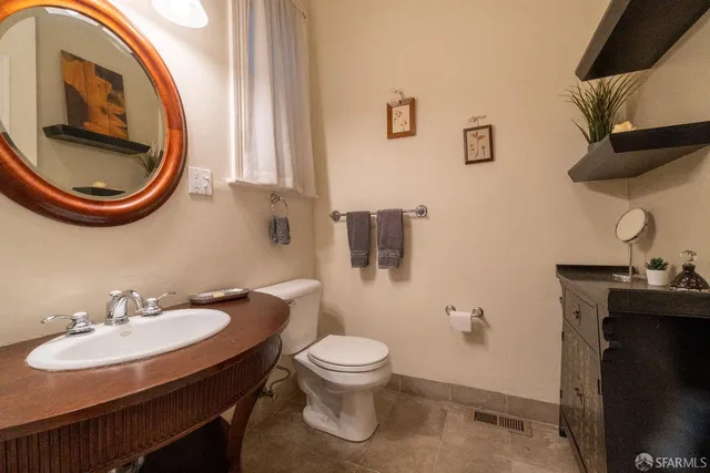 a view of sign board with potted plants