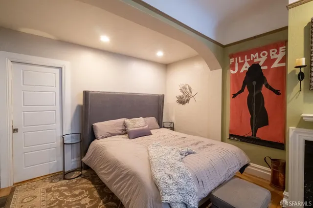 a bedroom with a bed and a closet