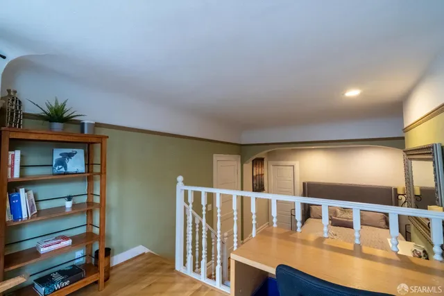 a view of living room with furniture and book shelf
