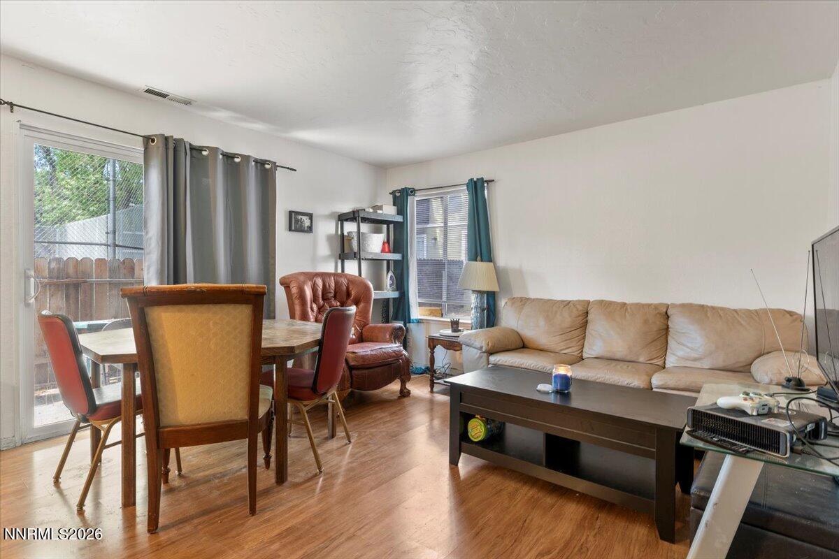 4608 Neil Road, Unit 269 Reno, NV 89502 - Photo 3 of 20 a living room with furniture and a flat screen tv