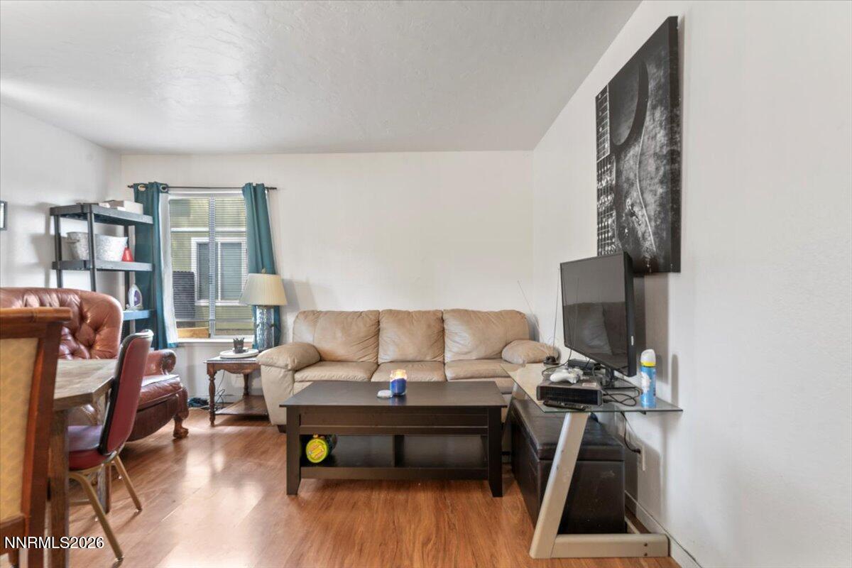 4608 Neil Road, Unit 269 Reno, NV 89502 - Photo 4 of 20 a living room with furniture and wooden floor