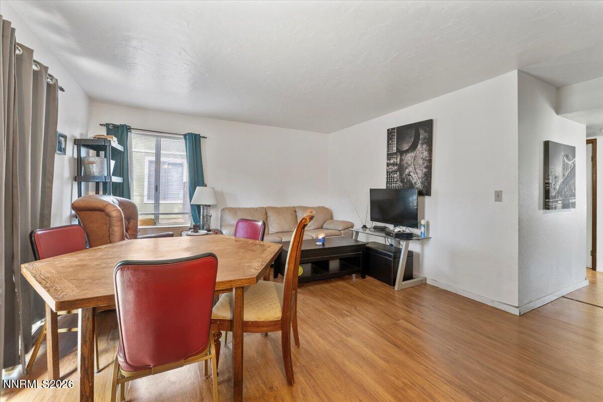 4608 Neil Road, Unit 269 Reno, NV 89502 - Photo 5 of 20 a view of a dining room with furniture and wooden floor