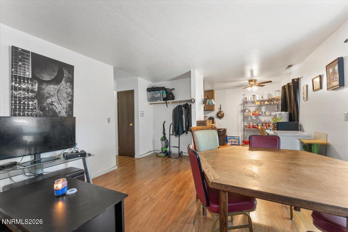 4608 Neil Road, Unit 269 Reno, NV 89502 - Photo 6 of 20 a dining room with furniture and a flat screen tv
