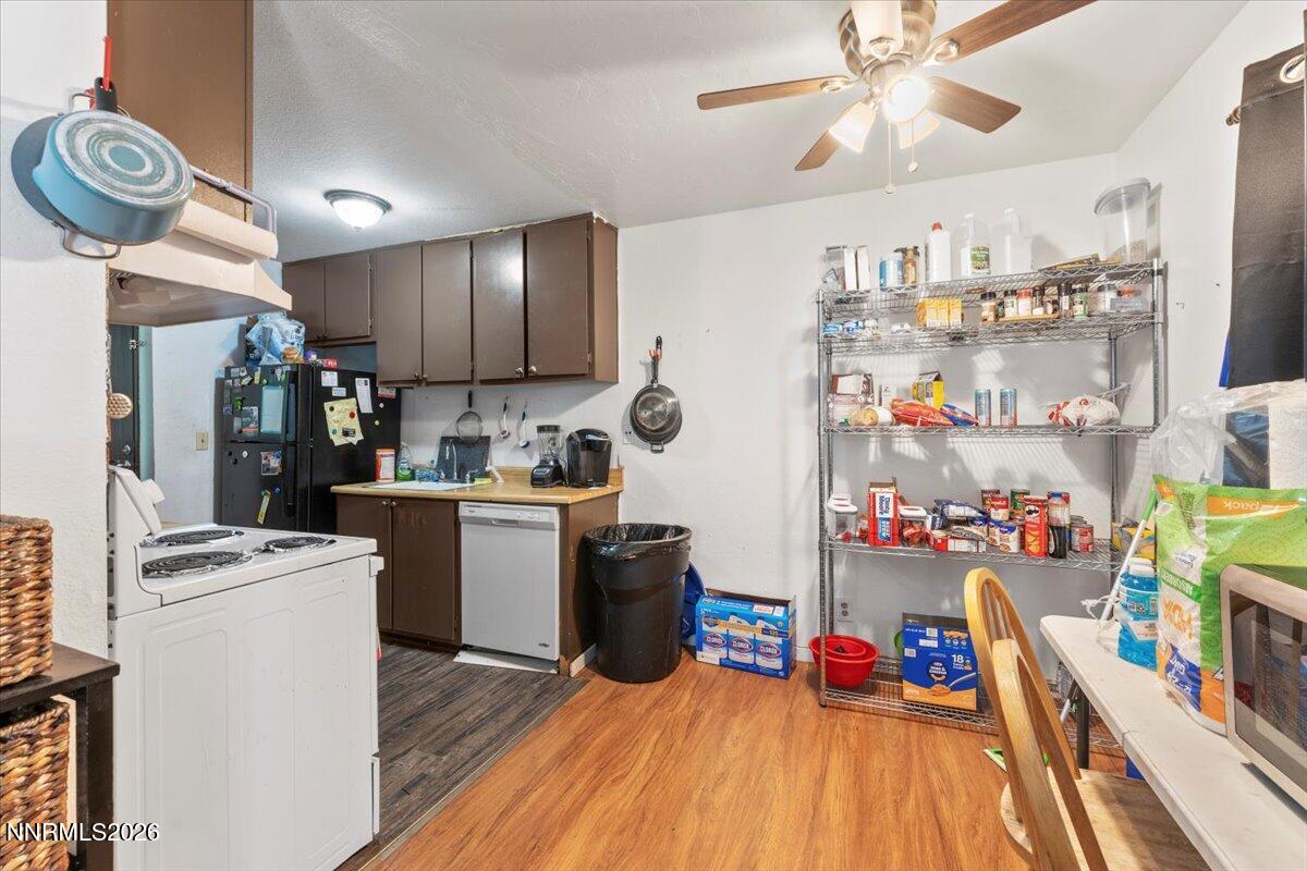 4608 Neil Road, Unit 269 Reno, NV 89502 - Photo 7 of 20 a kitchen that has a lot of cabinets and refrigerator