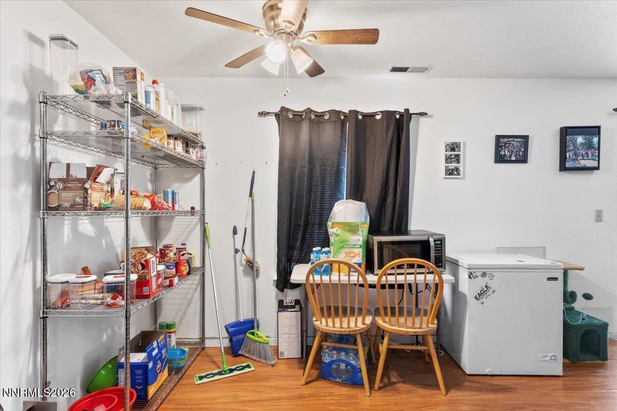 4608 Neil Road, Unit 269 Reno, NV 89502 - Photo 8 of 20 a view of a room with lots of chairs and wooden floor