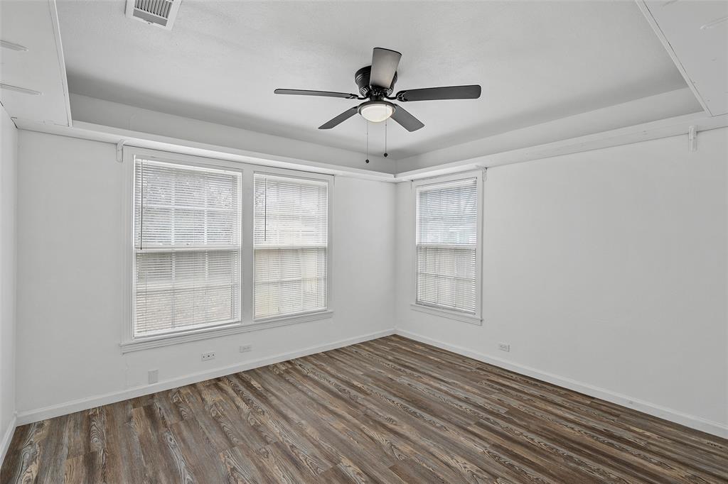 3104 Fadal Avenue Waco, TX 76708 - Photo 12 of 17 a view of empty room with wooden floor and fan
