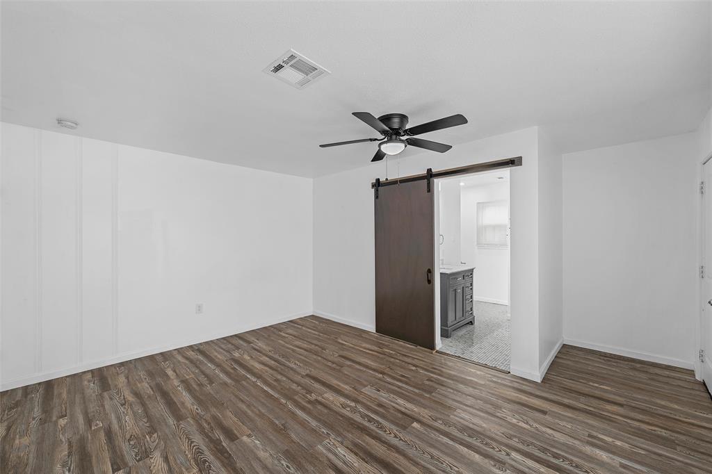 3104 Fadal Avenue Waco, TX 76708 - Photo 10 of 17 a view of a room with wooden floor and a ceiling fan
