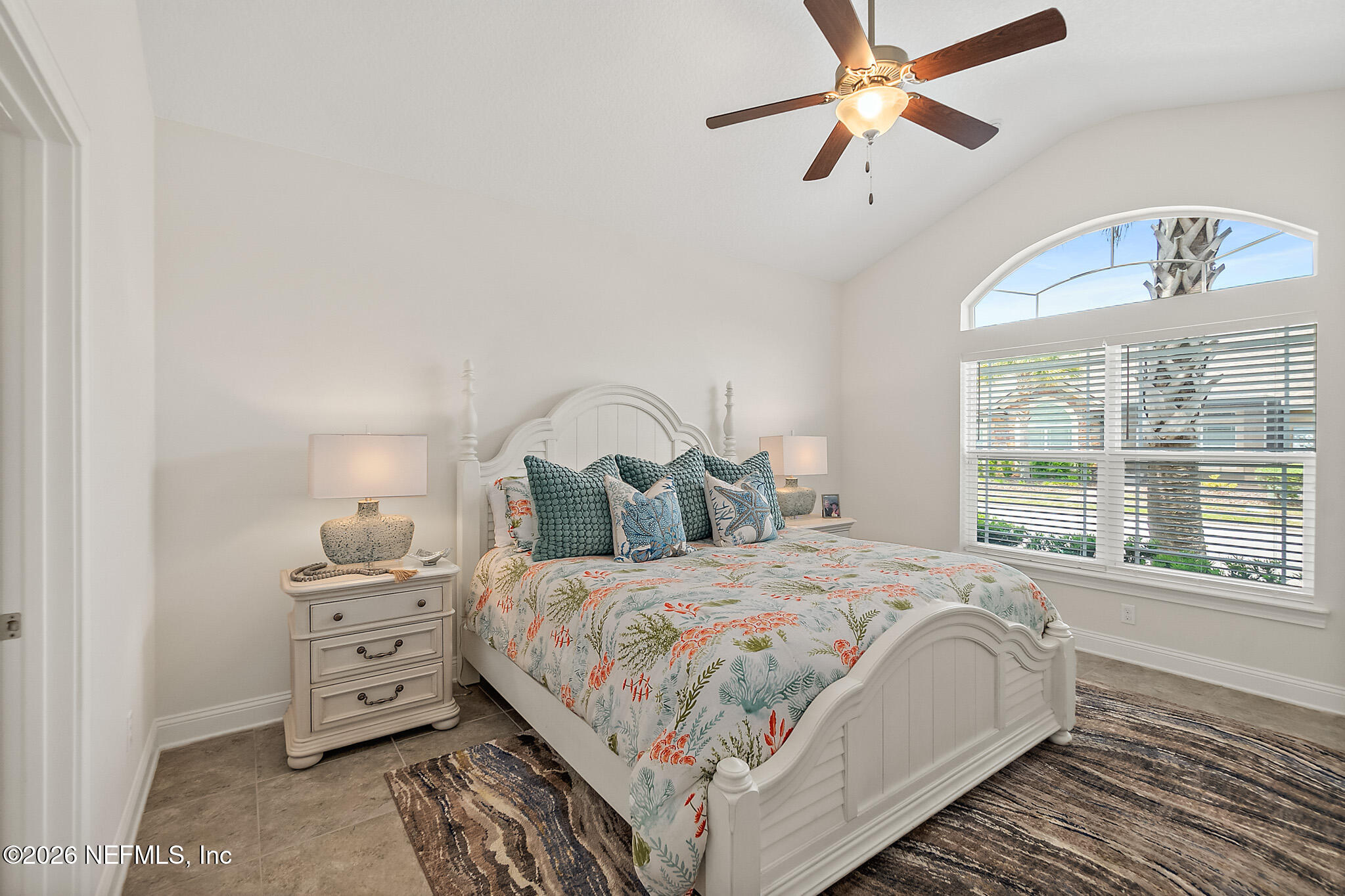 44 Utina Way St. Augustine, FL 32084 - Photo 20 of 48 a bedroom with a bed a window and a chandelier