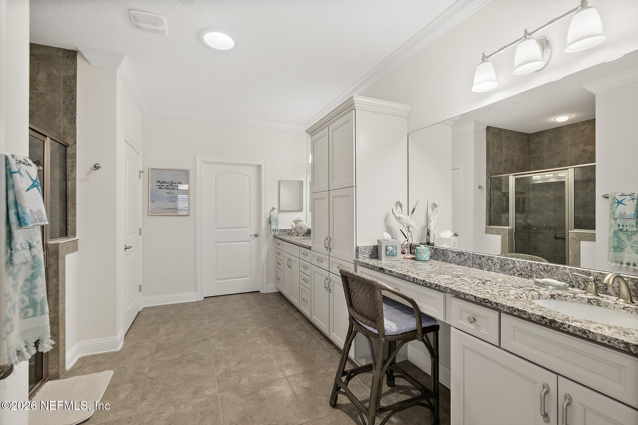 44 Utina Way St. Augustine, FL 32084 - Photo 22 of 48 a bathroom with a granite countertop sink and a mirror