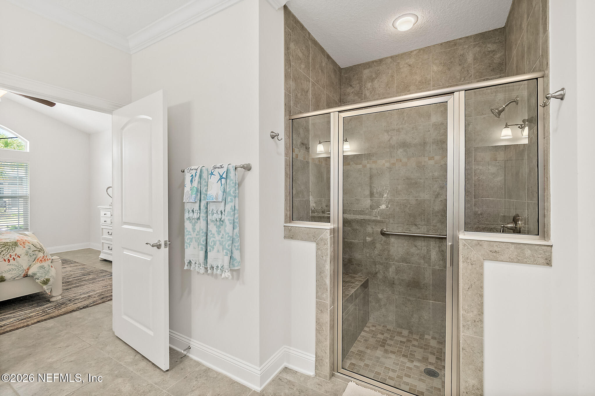 44 Utina Way St. Augustine, FL 32084 - Photo 23 of 48 a bathroom with a glass shower door