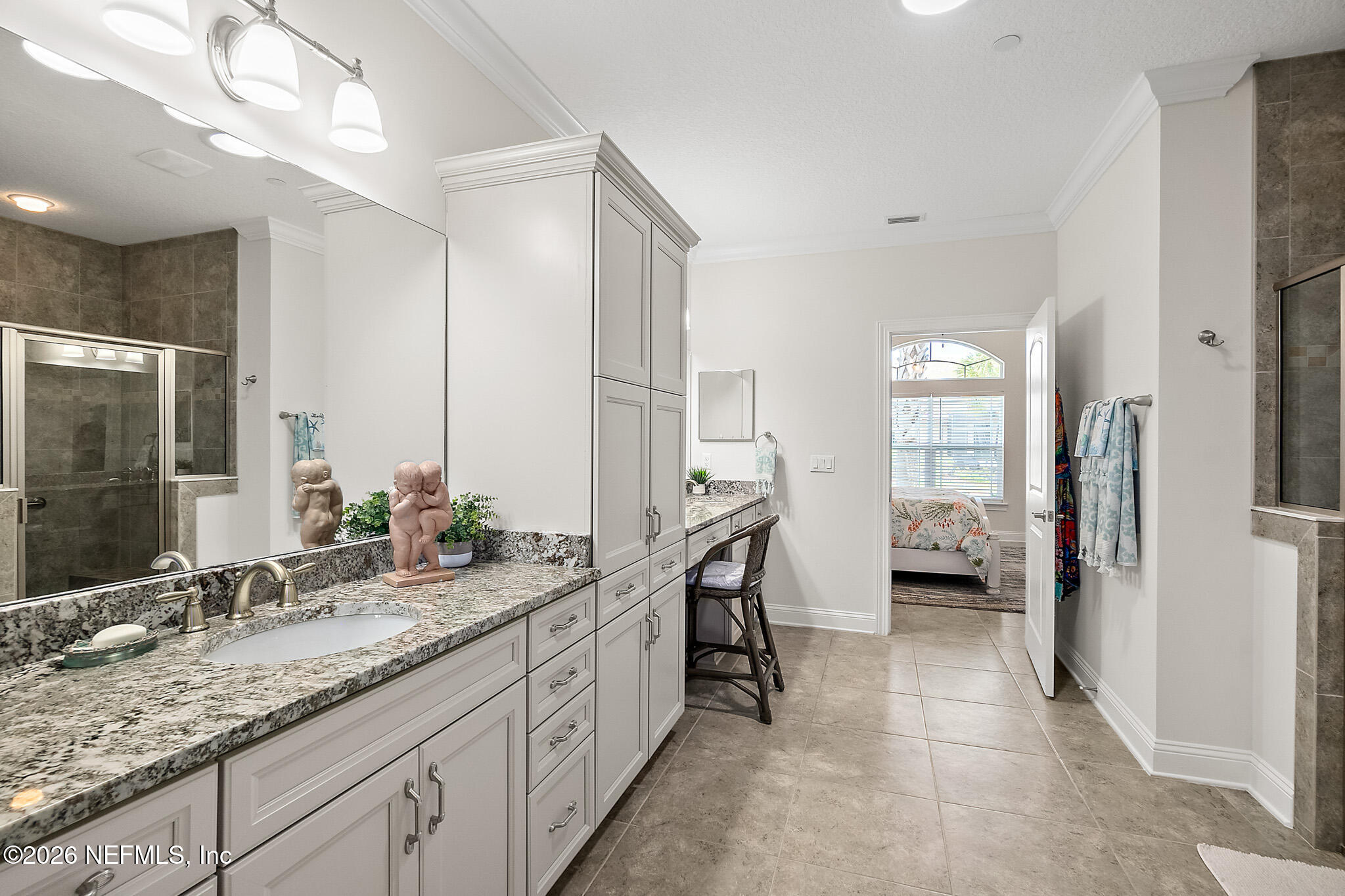 44 Utina Way St. Augustine, FL 32084 - Photo 24 of 48 a spacious bathroom with a granite countertop sink mirror and double
