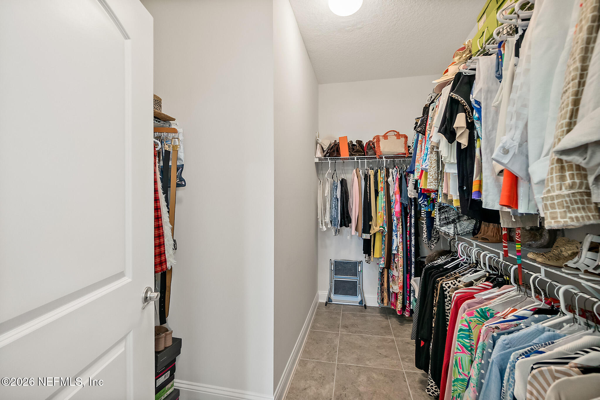 44 Utina Way St. Augustine, FL 32084 - Photo 25 of 48 a view of walk in closet with clothes and shoes