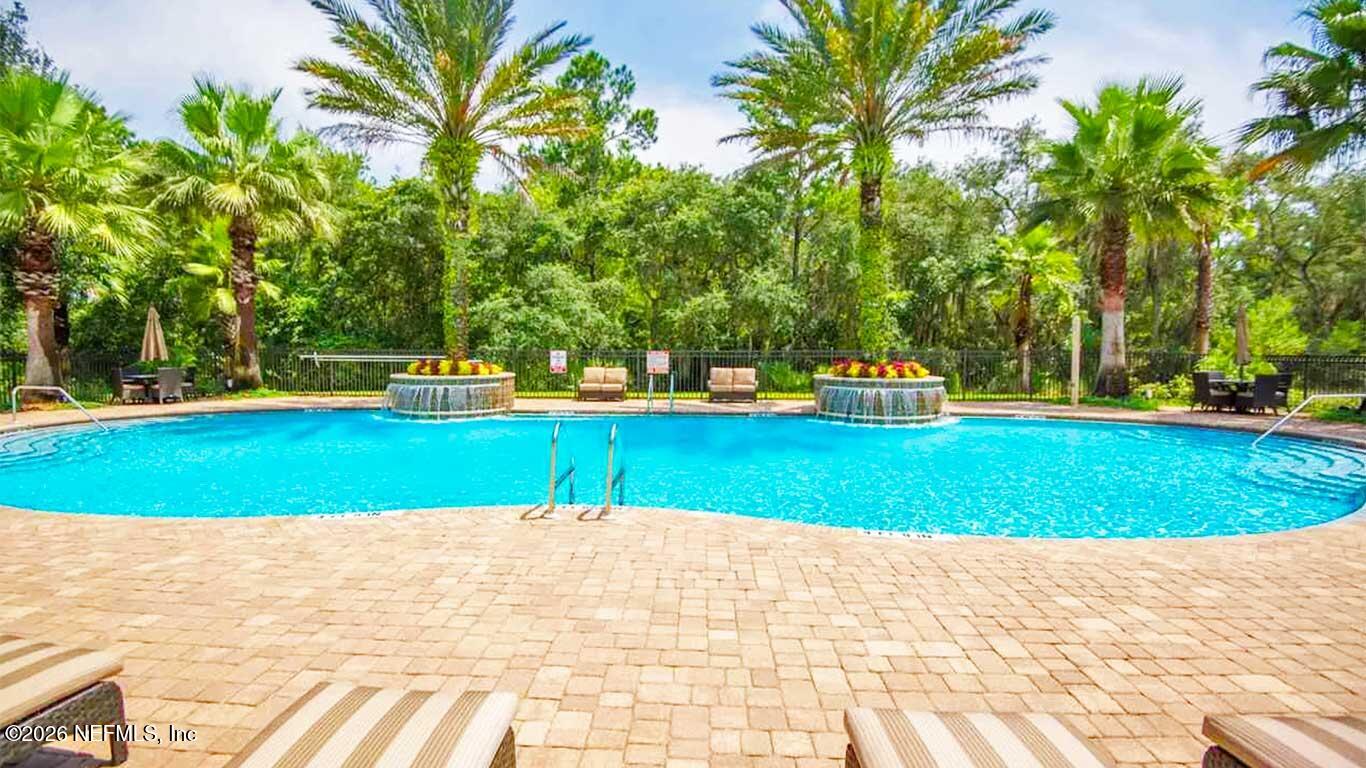 44 Utina Way St. Augustine, FL 32084 - Photo 42 of 48 a view of a swimming pool with a yard
