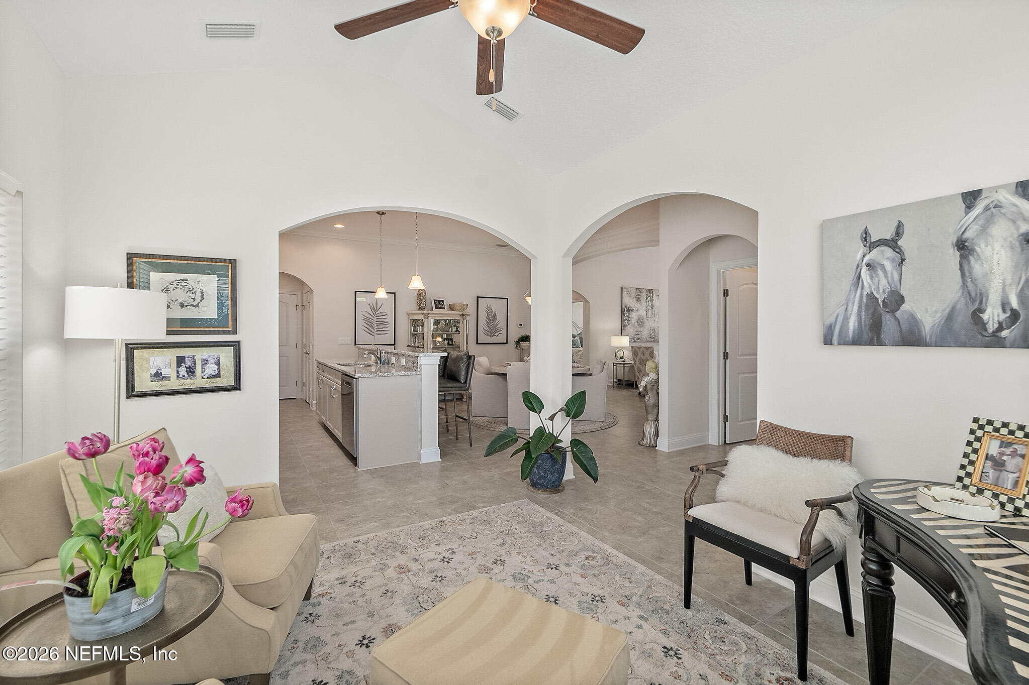 44 Utina Way St. Augustine, FL 32084 - Photo 7 of 48 a living room with furniture flowerpot and a chandelier