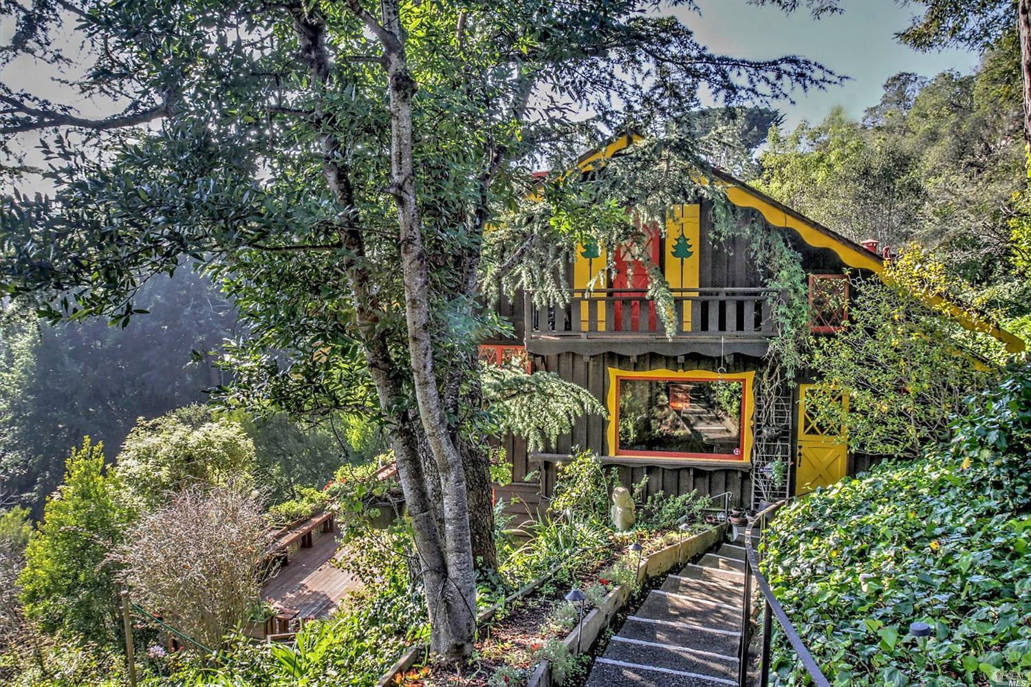a view of a street with wooden fence and plants