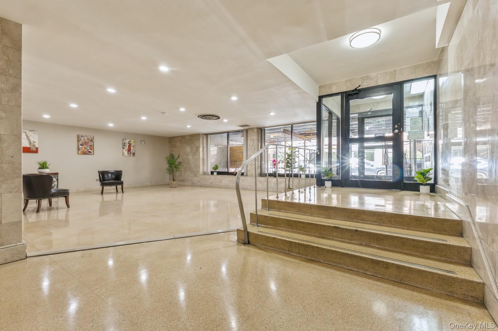 99-10 60th Avenue, Unit 1A Queens, NY 11368 - Photo 9 of 10 Lobby featuring stairway and recessed lighting