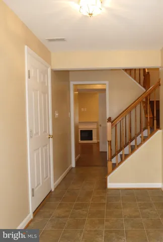 a view of an entryway with wooden floor