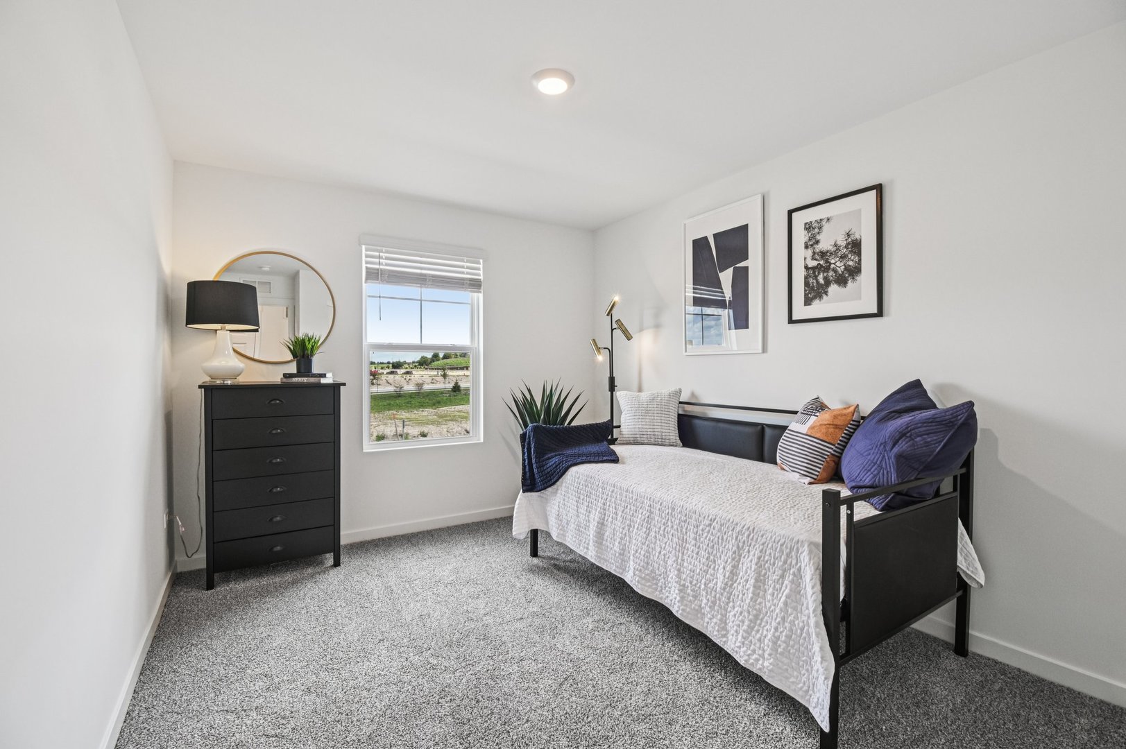 2497 Semillon Street Oswego, IL 60543 - Photo 26 of 37 a bedroom with a bed and a dresser