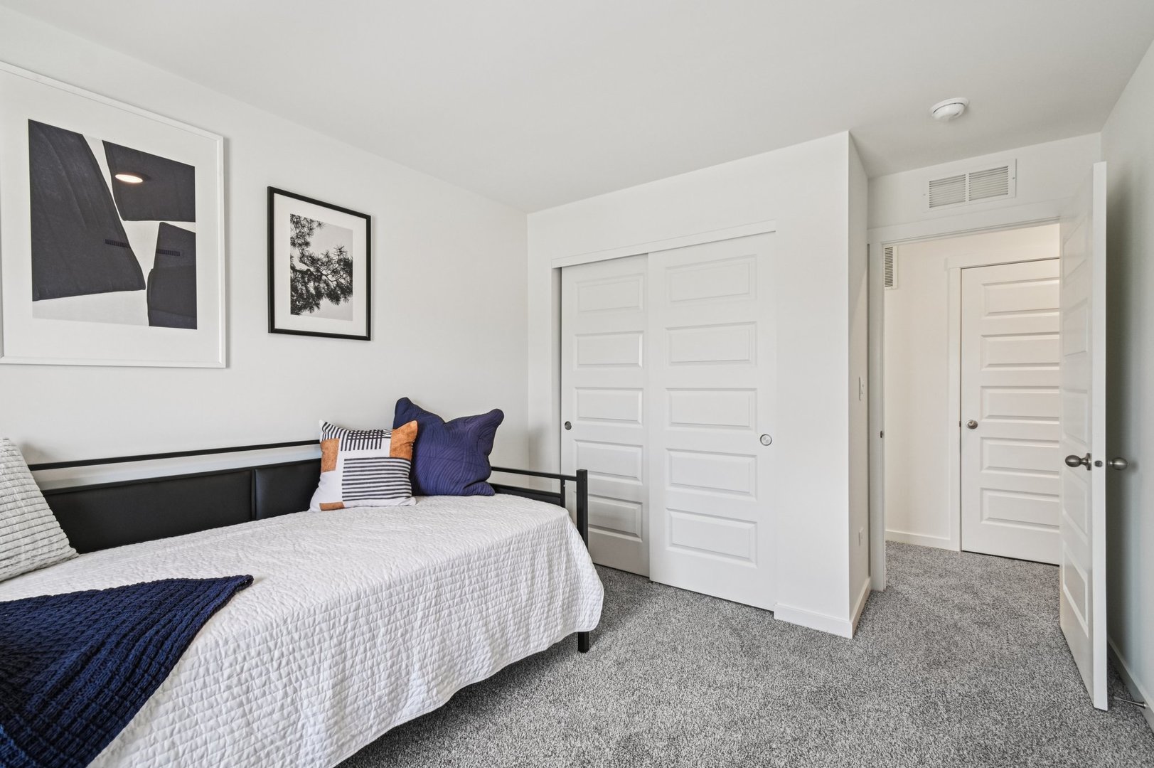 2497 Semillon Street Oswego, IL 60543 - Photo 27 of 37 a bedroom with a bed and cabinet