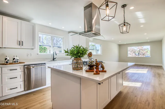 a view of a room with wooden floor