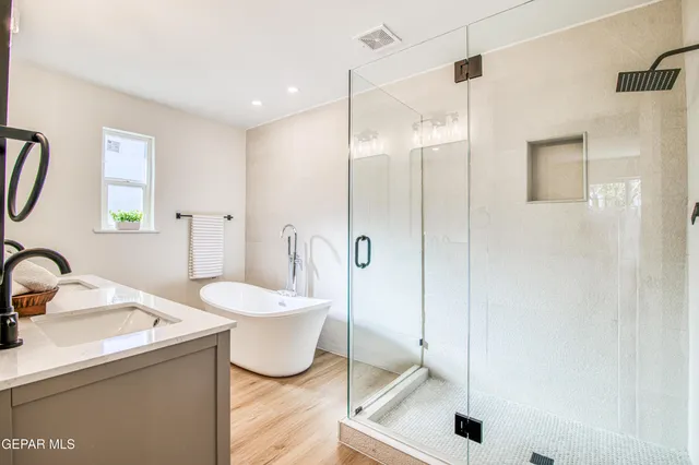 a aerial view of a house next to a big yard and large trees
