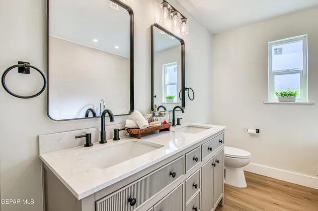 a view of a house with a yard and pathway