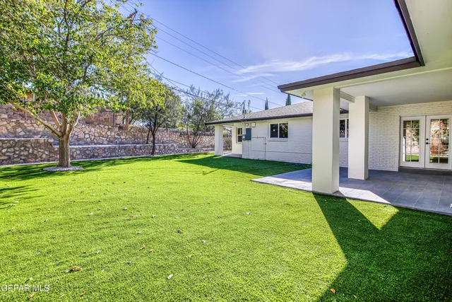 a view of a kitchen with a sink and a stove top oven