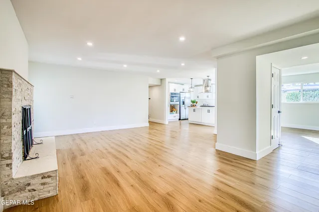 a view of hallway with wooden floor