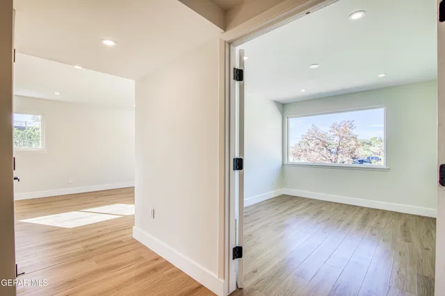 a kitchen with stainless steel appliances kitchen island granite countertop a refrigerator a stove a microwave and island