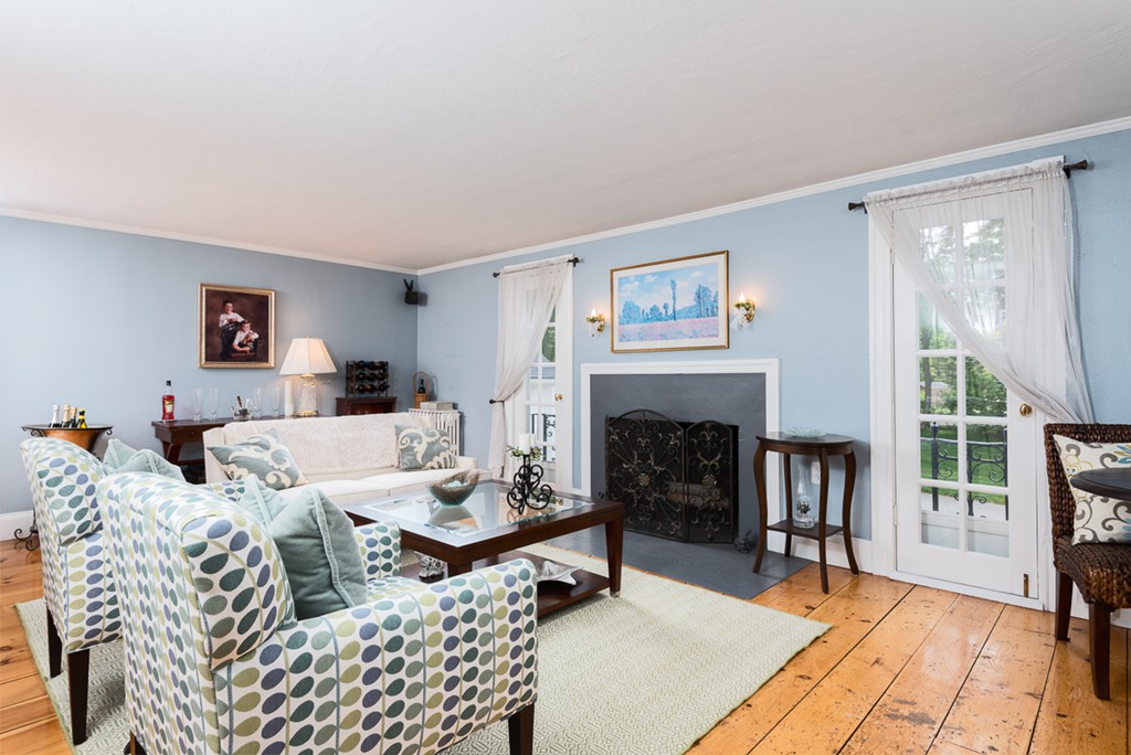 68 Cross Street Hingham, MA 02043 - Photo 11 of 26 a living room with furniture and a fireplace