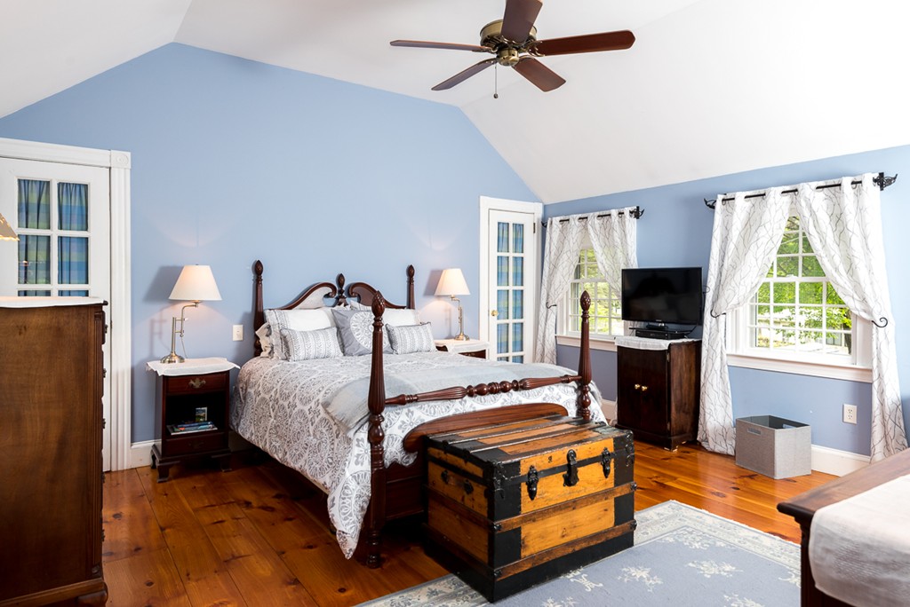 68 Cross Street Hingham, MA 02043 - Photo 17 of 26 a bedroom with a bed and a flat screen tv