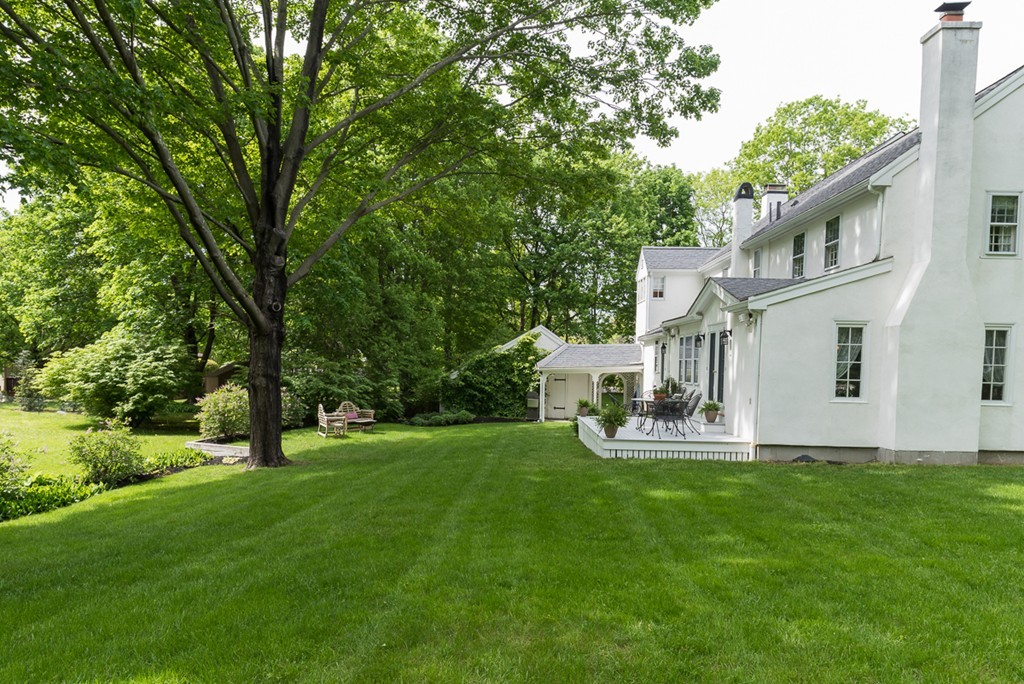 68 Cross Street Hingham, MA 02043 - Photo 23 of 26 a garden with trees in front of it