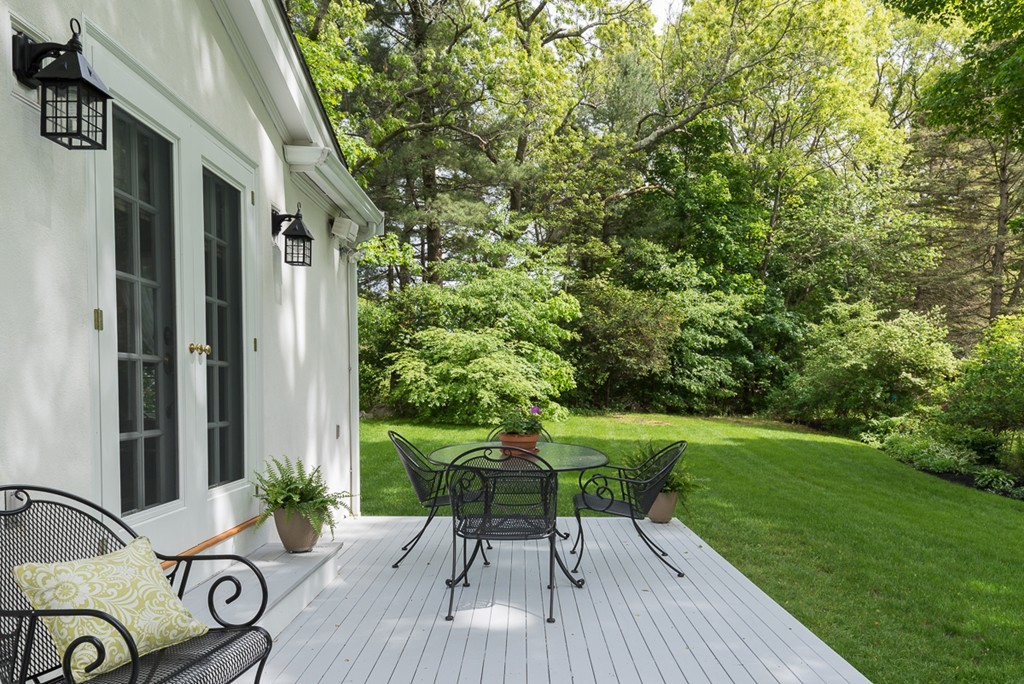 68 Cross Street Hingham, MA 02043 - Photo 24 of 26 a view of backyard with a table and chairs and potted plants