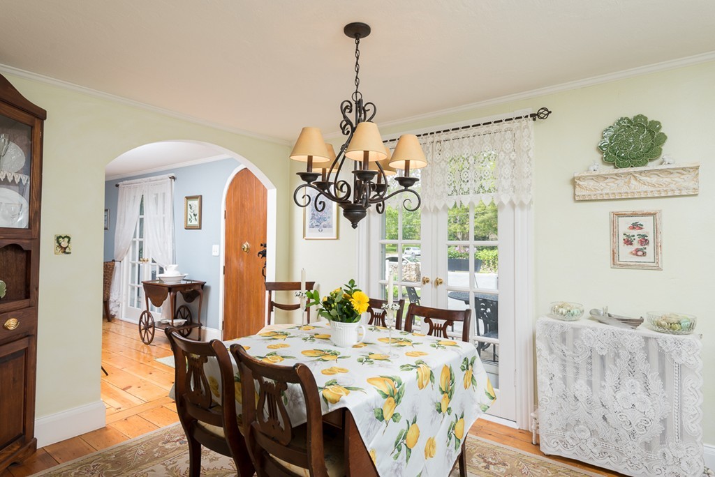 68 Cross Street Hingham, MA 02043 - Photo 4 of 26 a living room with furniture and a chandelier