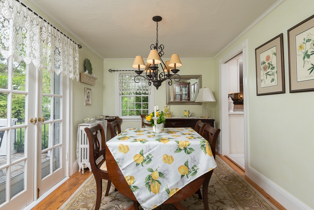 68 Cross Street Hingham, MA 02043 - Photo 5 of 26 a view of a dining room with furniture and a chandelier