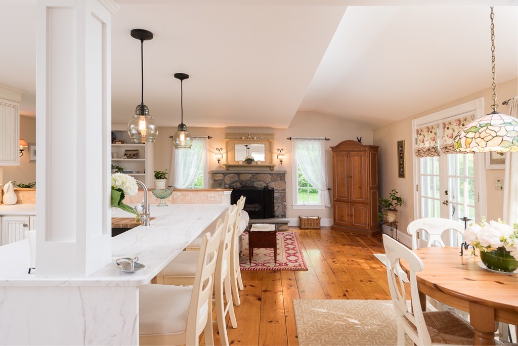 68 Cross Street Hingham, MA 02043 - Photo 9 of 26 a living room with furniture a fireplace a flat screen tv and a window