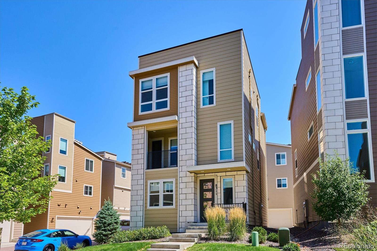 8311 Riverscape Court Highlands Ranch, CO 80129 - Photo 1 of 50 a front view of a multi story residential apartment building