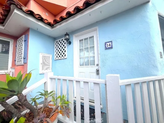 a view of a patio with table and chairs and potted plants