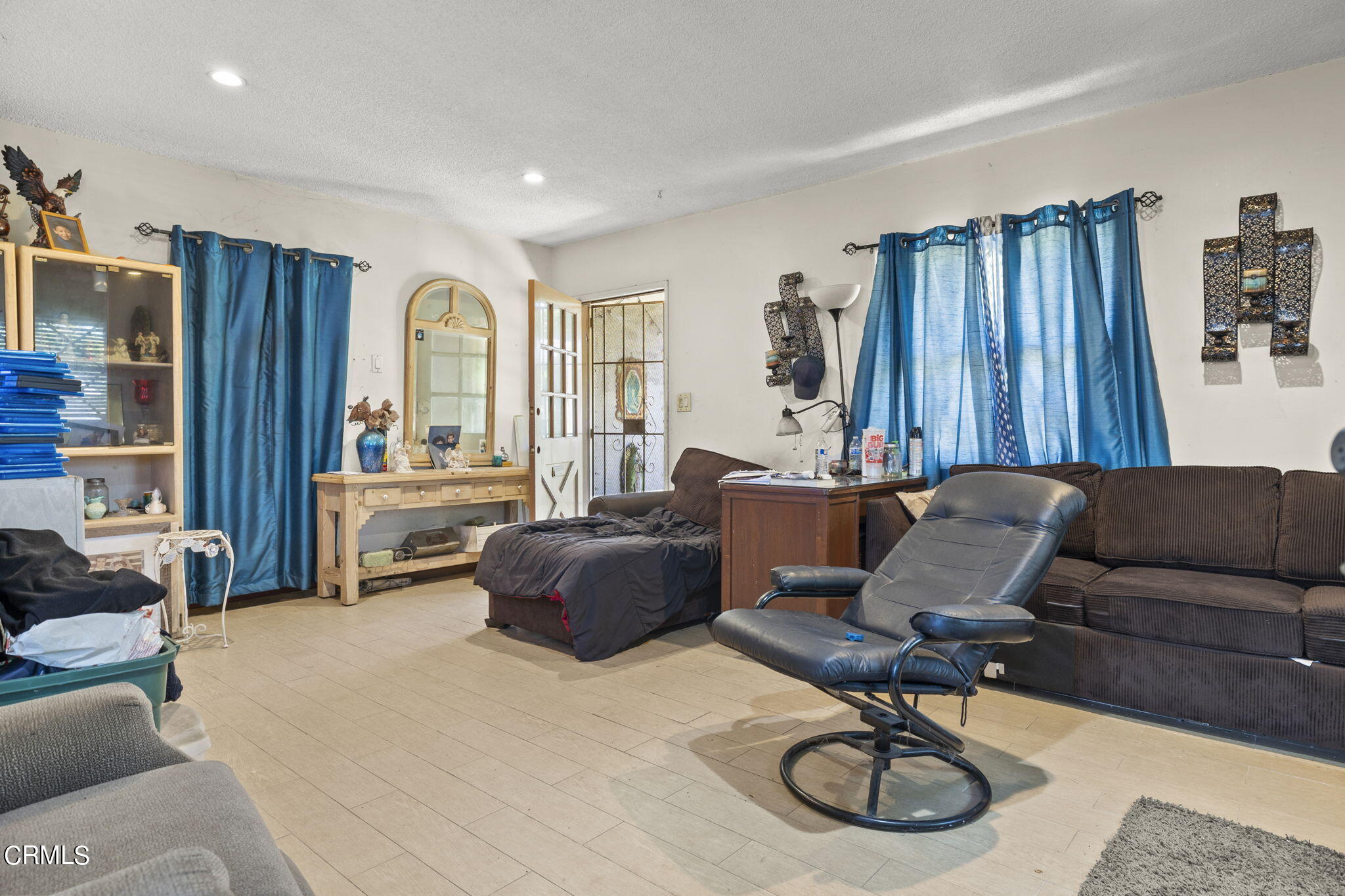 4829 Saviers Road Oxnard, CA 93033 - Photo 11 of 31 a living room with furniture a rug and a large window