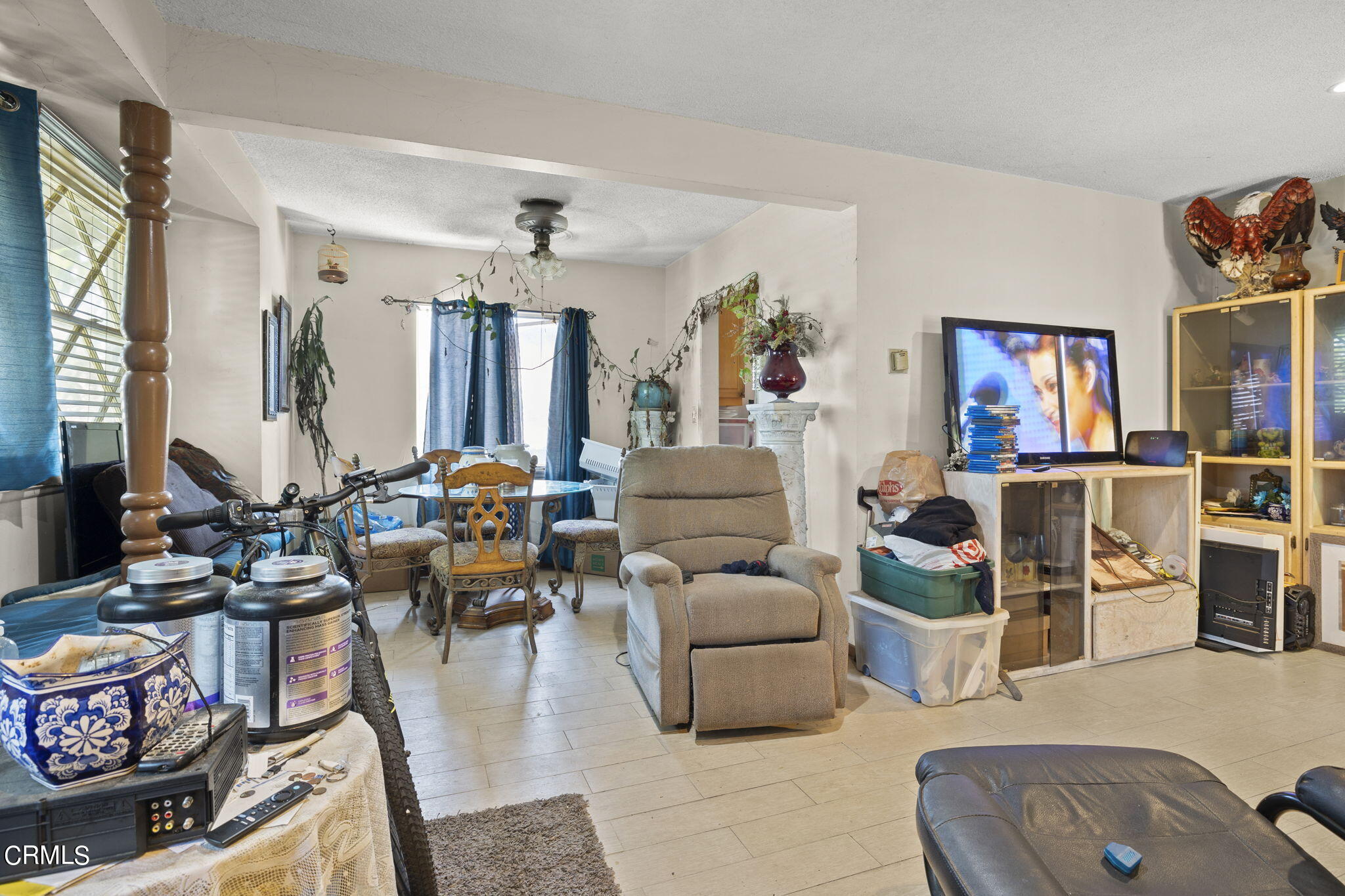 4829 Saviers Road Oxnard, CA 93033 - Photo 12 of 31 a living room with furniture and a chandelier