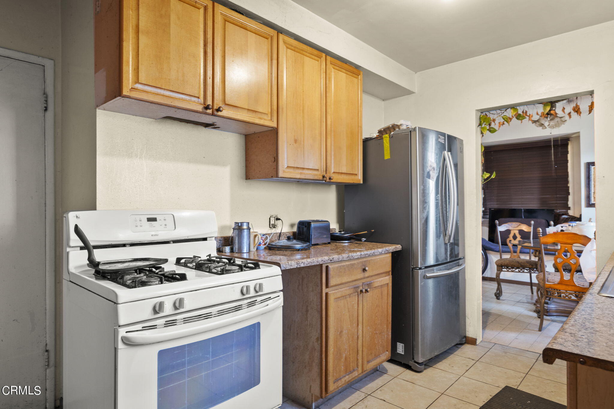 4829 Saviers Road Oxnard, CA 93033 - Photo 17 of 31 a kitchen with a stove microwave and refrigerator