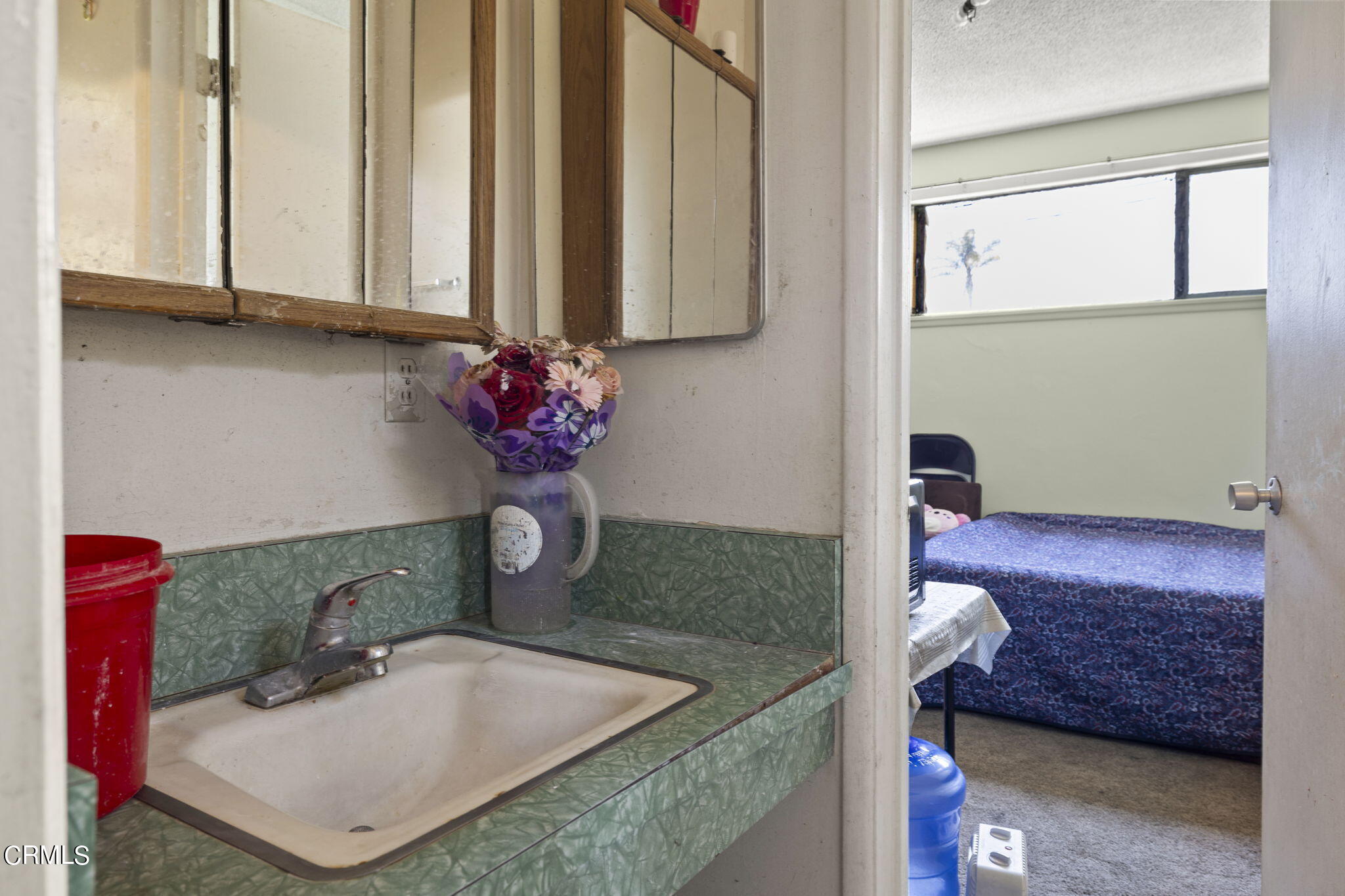 4829 Saviers Road Oxnard, CA 93033 - Photo 20 of 31 a bathroom with a sink and a mirror