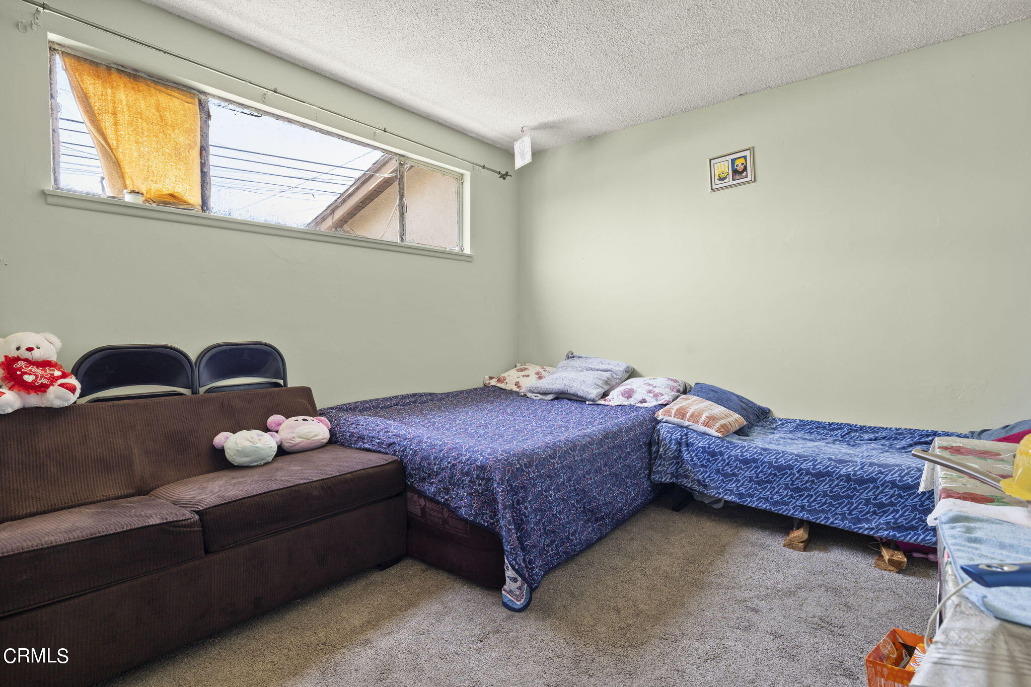 4829 Saviers Road Oxnard, CA 93033 - Photo 21 of 31 a bedroom with a bed and window