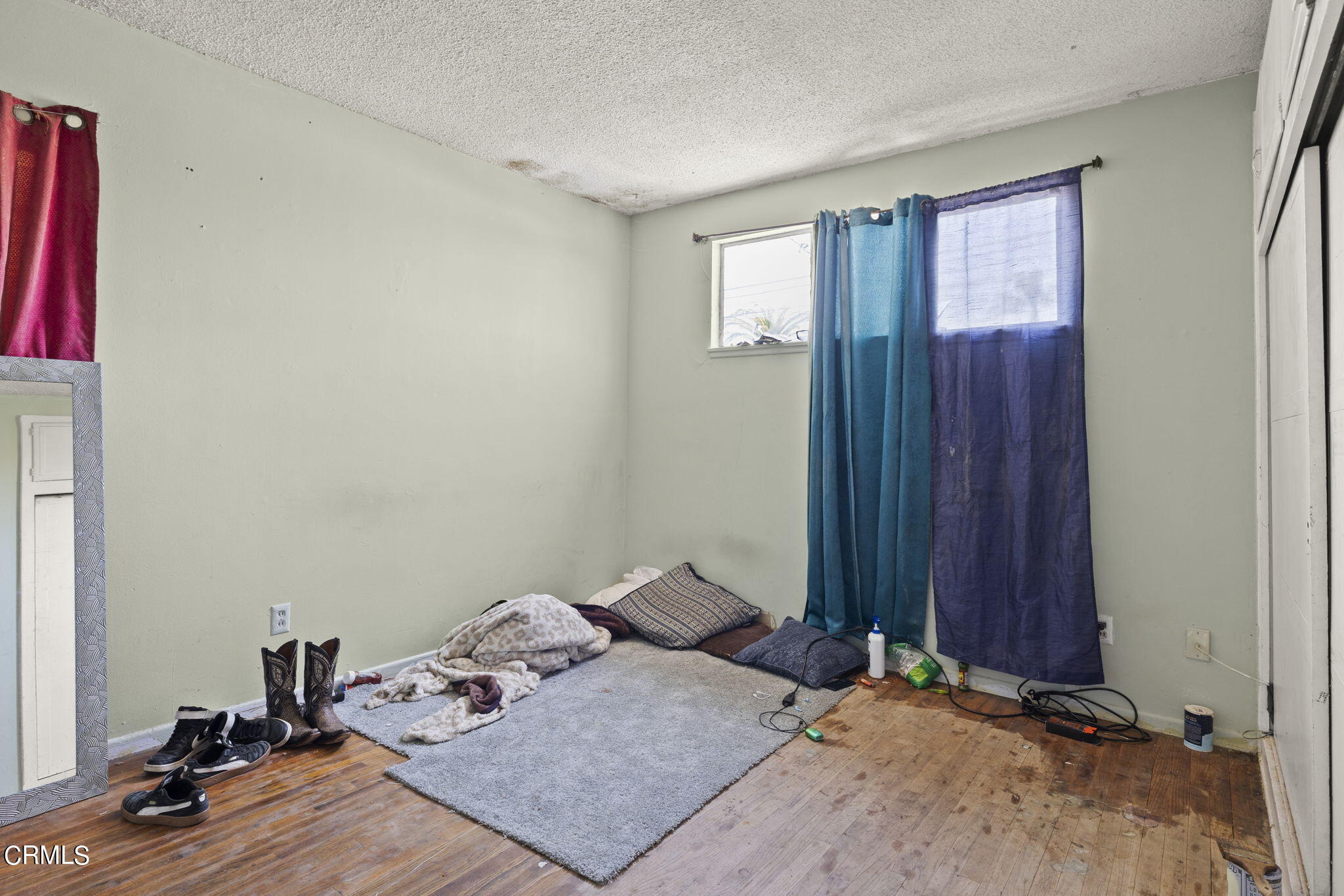 4829 Saviers Road Oxnard, CA 93033 - Photo 25 of 31 a bedroom with a bed and a window