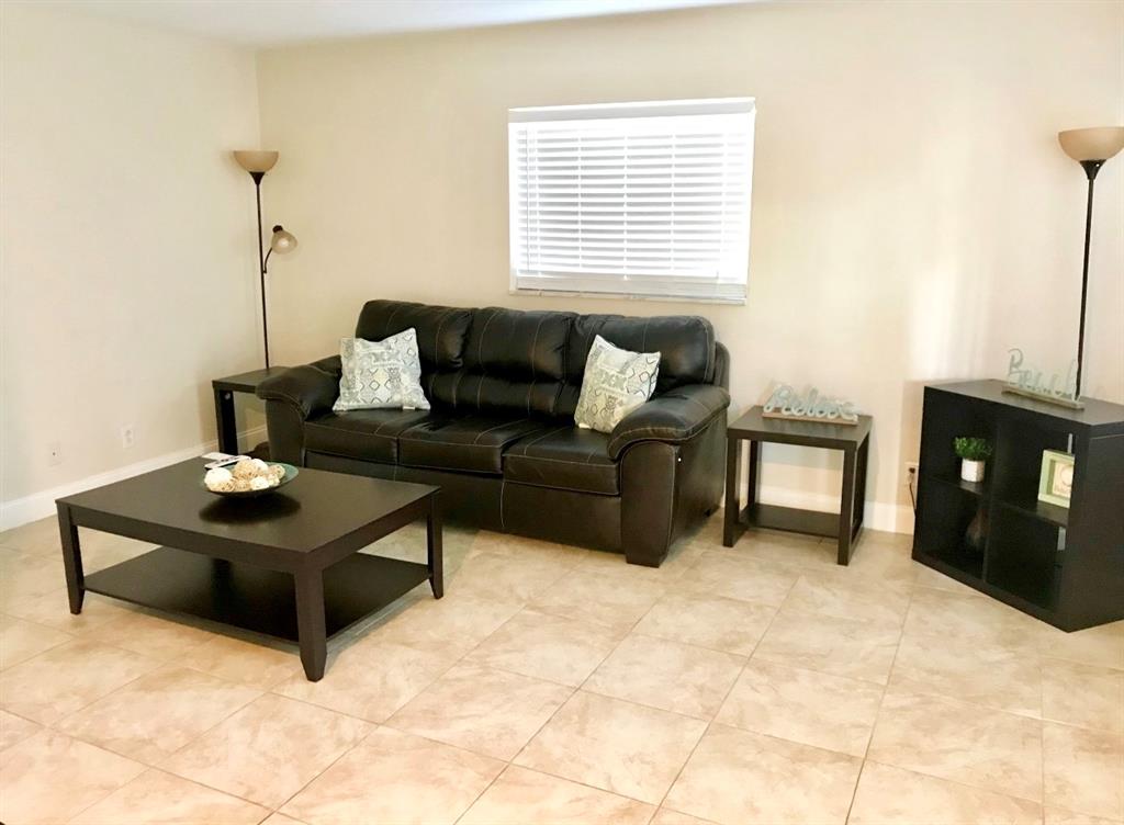 201 Inlet Way Palm Beach Shores, FL 33404 - Photo 6 of 9 a living room with furniture and a table