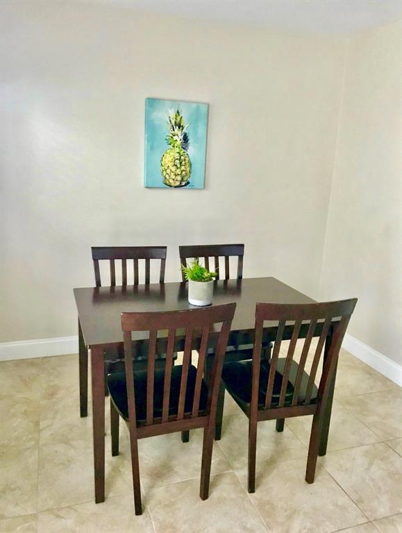 201 Inlet Way Palm Beach Shores, FL 33404 - Photo 7 of 9 a view of a dining room with furniture