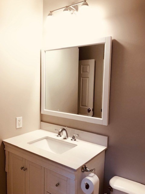 88 St Botolph Street, Unit 3 Boston, MA 02116 - Photo 9 of 11 a bathroom with a sink and a mirror