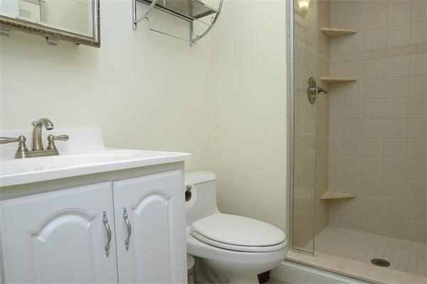 88 St Botolph Street, Unit 3 Boston, MA 02116 - Photo 10 of 11 a bathroom with a sink a toilet and shower