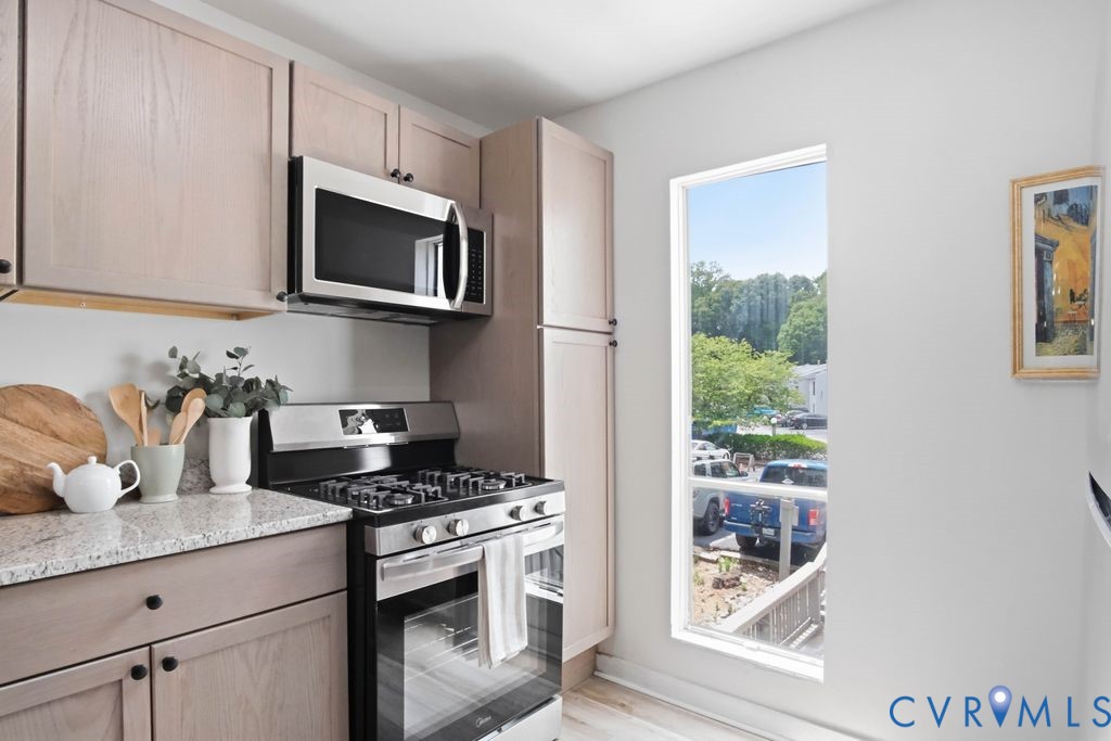 10270 Iron Mill Road Richmond, VA 23235 - Photo 11 of 29 Compact kitchen featuring light-toned cabinetry an
