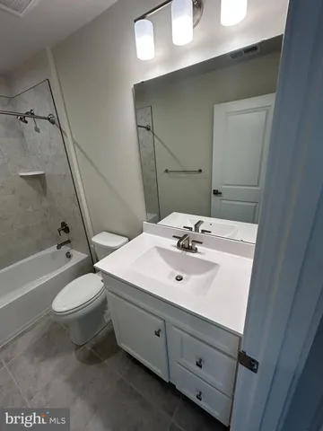 a bathroom with a sink a toilet and a bathtub
